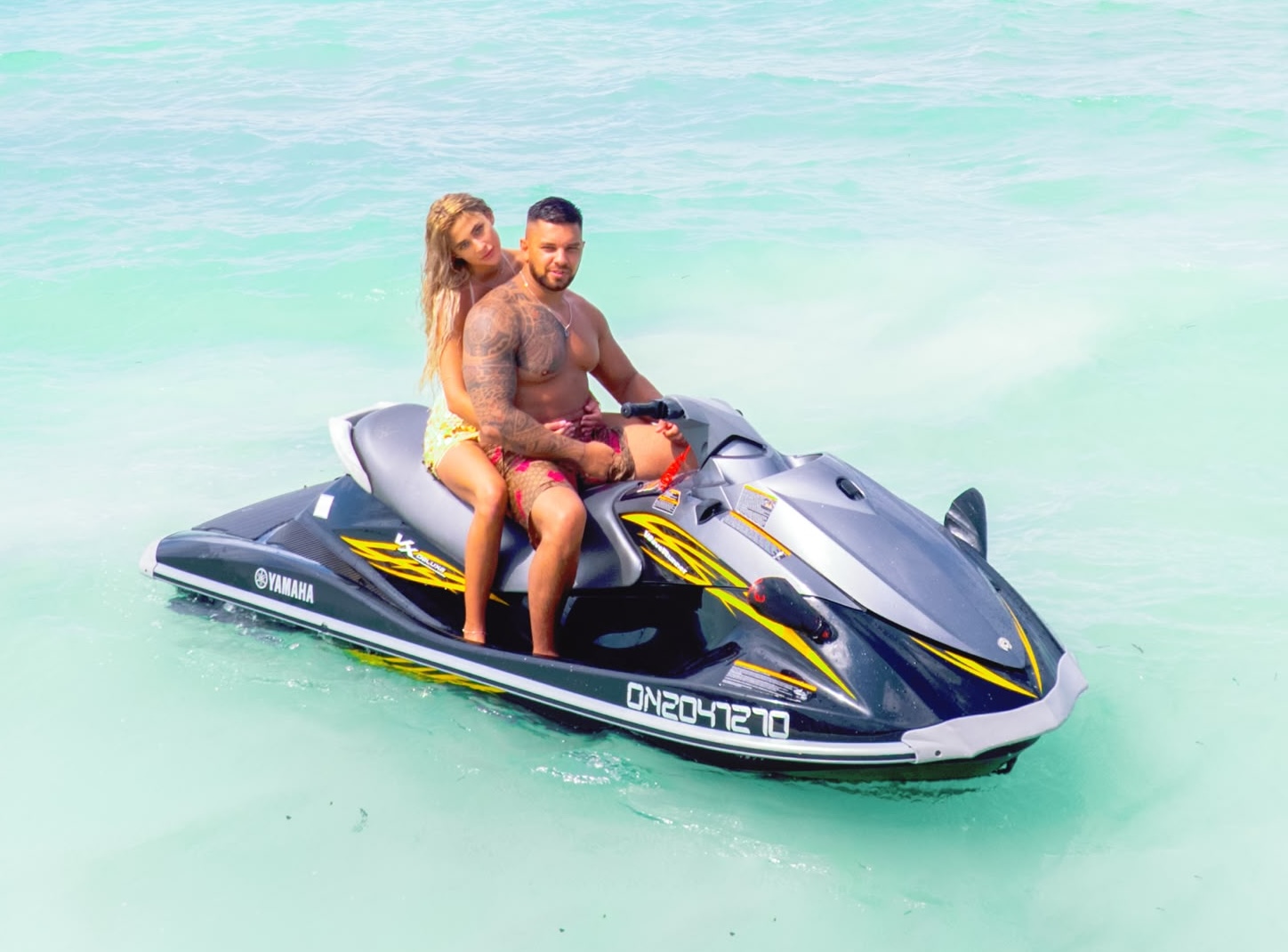 Jet ski in Paje, Zanzibar — couple riding a Yamaha jet ski on clear turquoise water